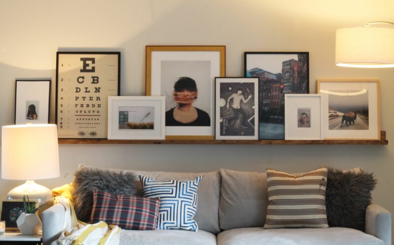 Framed Quotes on the Shelves Behind the Couch