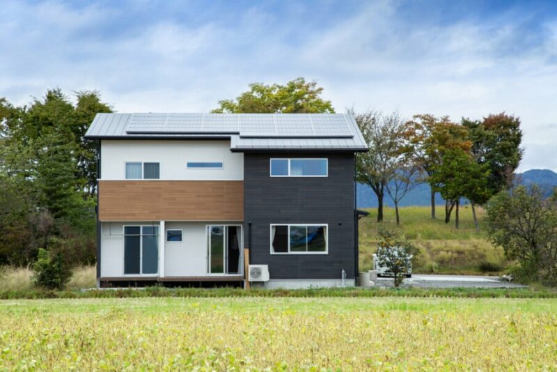 Solar Paneled Contemporary White House with Black Trim